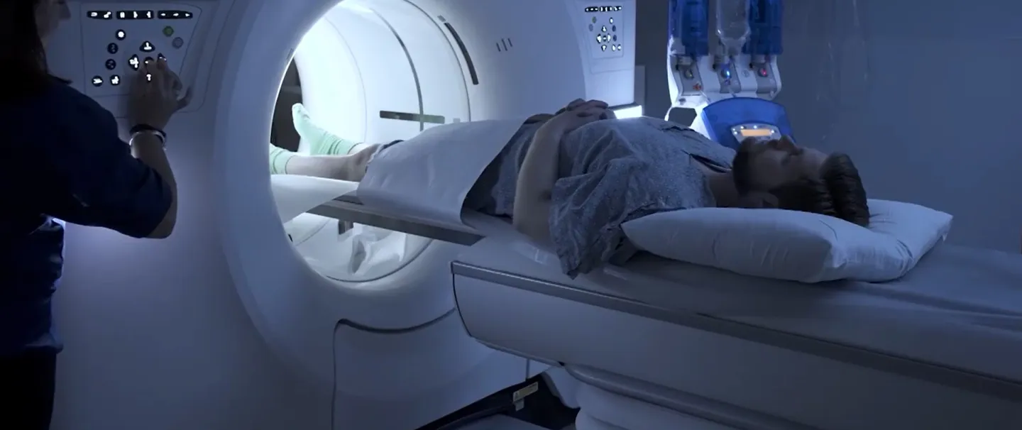 A man lays on a MRI bed as he prepares for a scan at South Shore Health