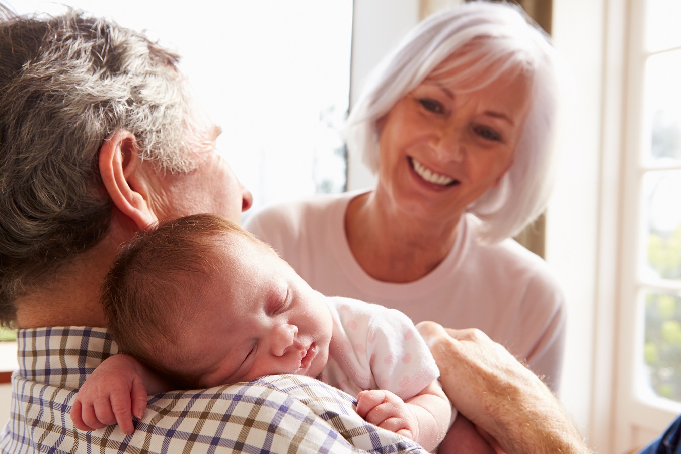 Grandparents taking care of their infant grandchild