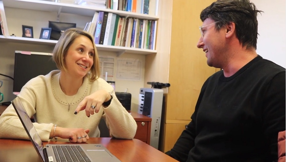 A female speech-language pathologist works with a male patient