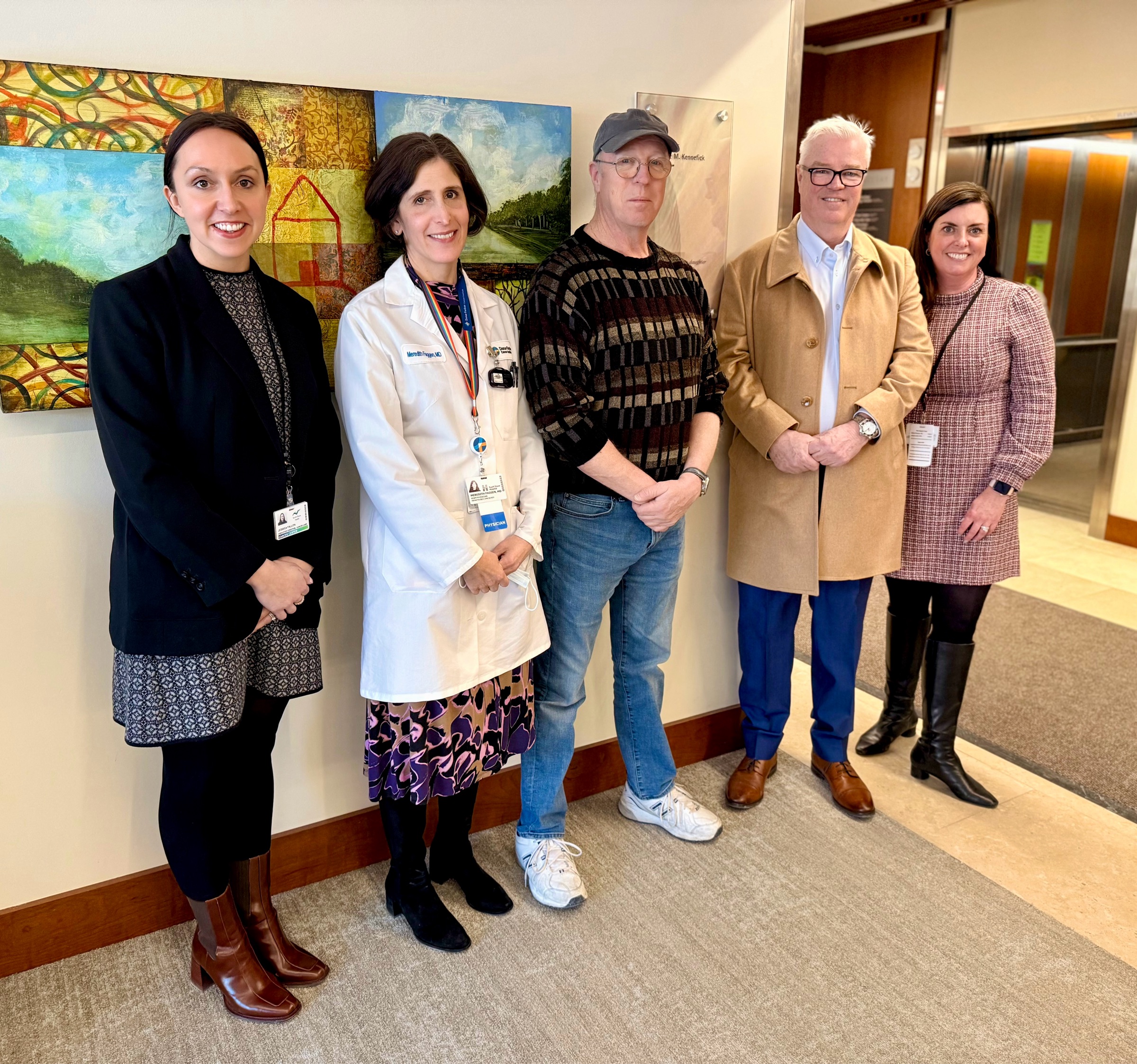 Colleagues from South Shore Health pose with members of the Kennefick family