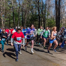Runners begin to run at the starting line of a recent South Shore Health Set the Pace Road Race