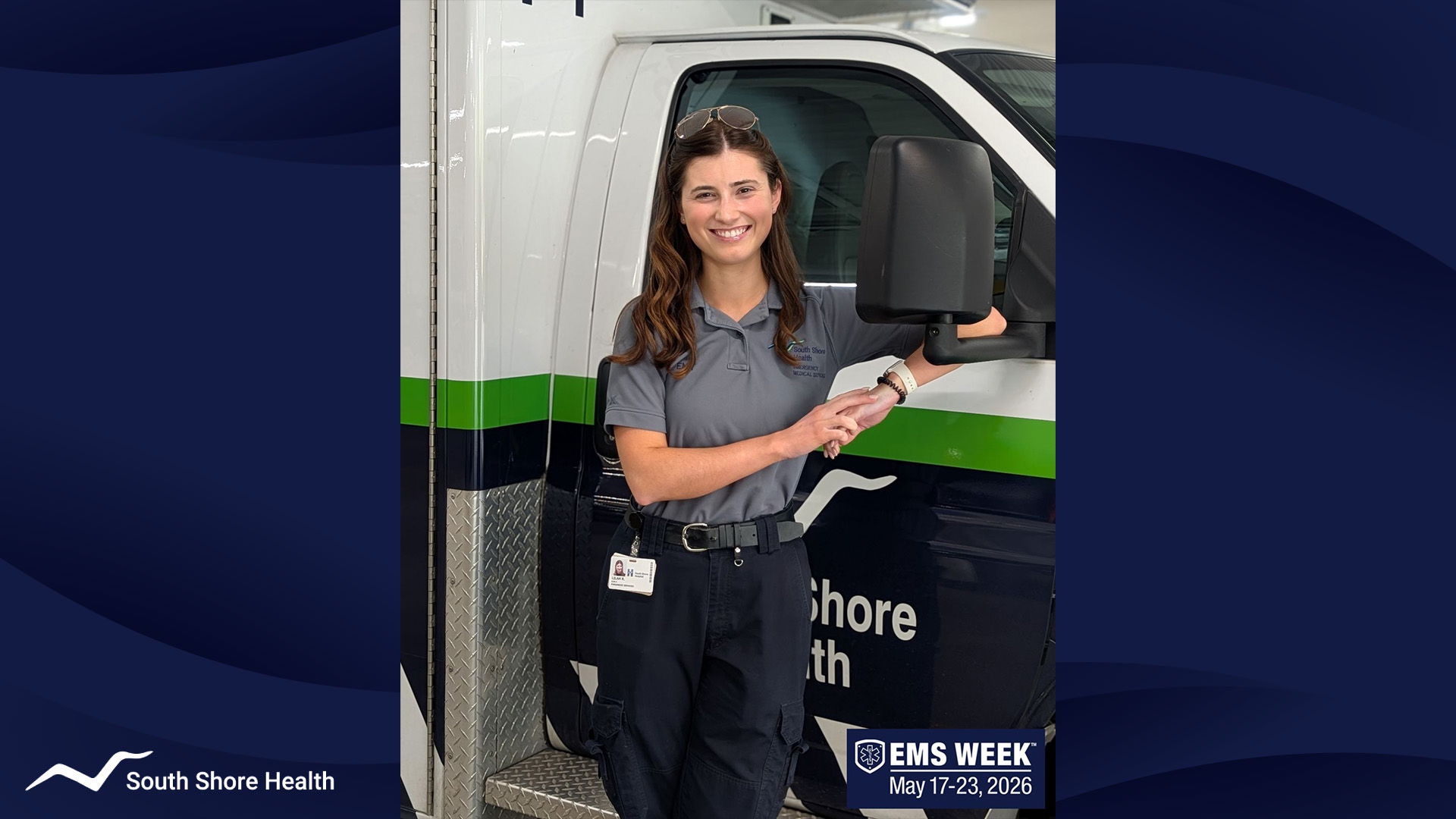 Photo of Lilah, an EMT at South Shore Health EMS, in front of a South Shore Health EMS ambulance