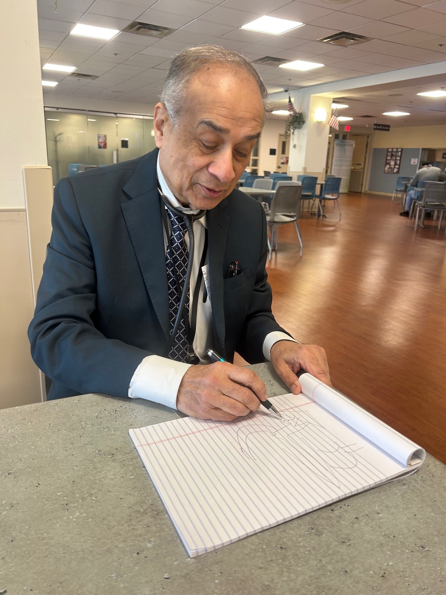 Dr. Rau draws a picture of the GI tract