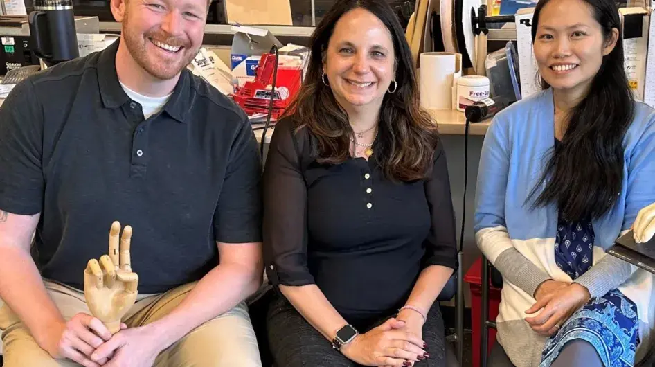 Three certified hand therapists from South Shore Health pose for a group photo.