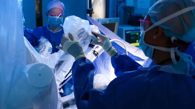 Caregivers prepare for an operation in a surgical suite at South Shore Hospital