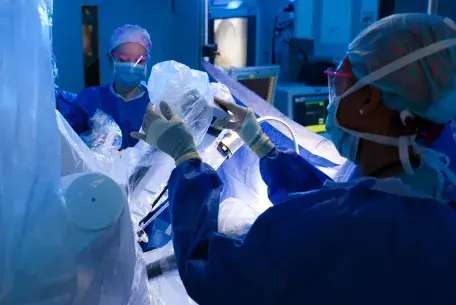 Caregivers prepare for an operation in a surgical suite at South Shore Hospital