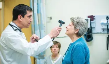 Doctor checking patient eyes