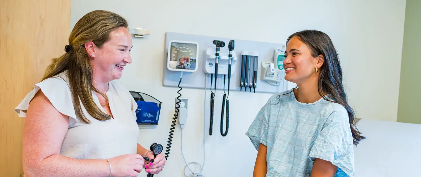 Abigail Gibbs of South Shore Medical Center smiles as she talks to a patient during a visit