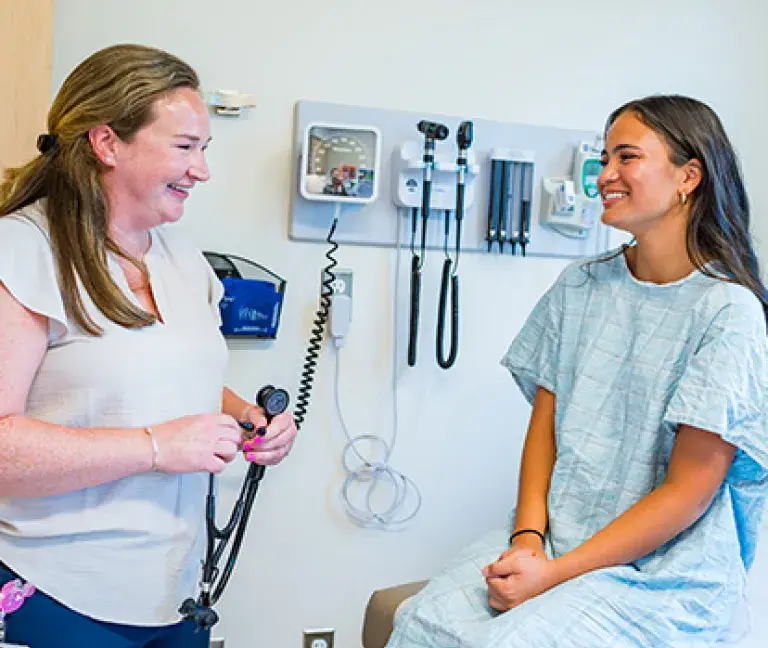 Abigail Gibbs of South Shore Medical Center smiles as she talks to a patient during a visit
