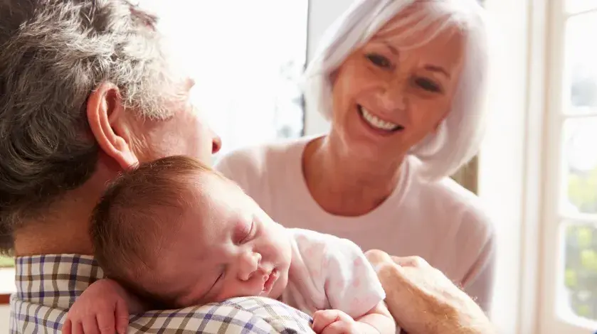 Grandparents taking care of their infant grandchild