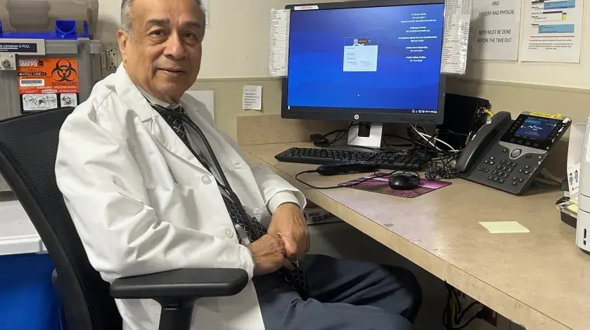 Prakash Rau, MD at his desk in the South Shore Hospital endoscopy suite