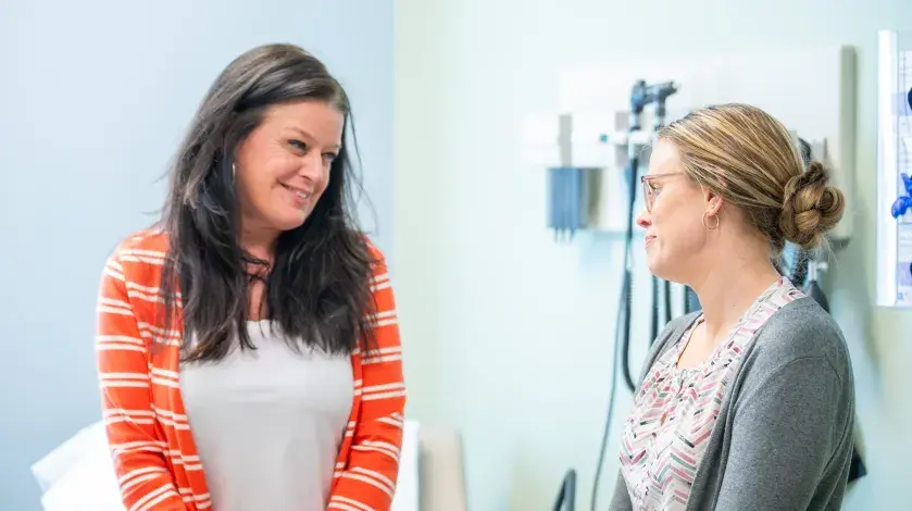 A female patient consults with a gynecologic provider