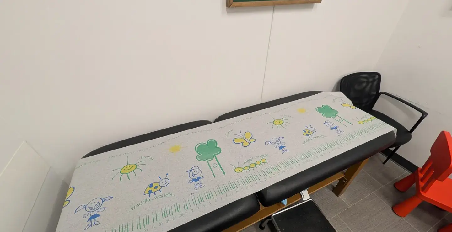 Close-up of kid-themed exam table paper at South Shore Health Urgent Care Braintree