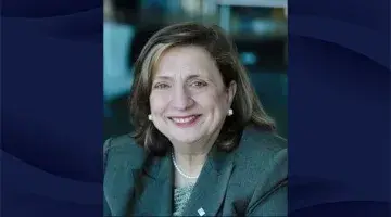 Photo of Rosanna DeMarco of South Shore Health's board of directors on a navy blue patterned background